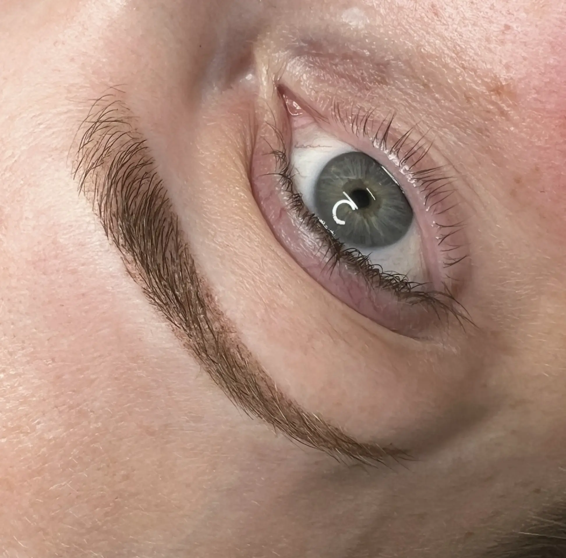 Melbourne cosmetic tattoo artist applying ombre brows